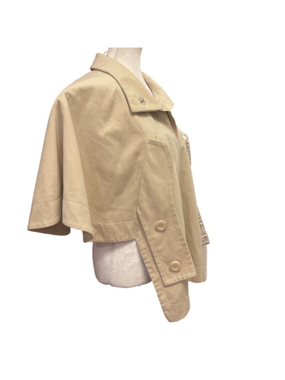 Cream coloured lined cape with pockets